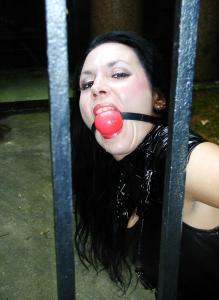 ginaraemichaels.com - Cuffed and ball gagged in pvc at the mausoleum PHOTOS thumbnail